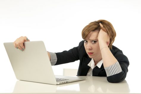 Frustrated woman with laptop