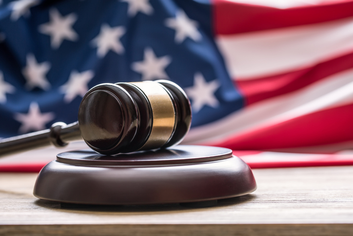 Gavel in front of an American flag.